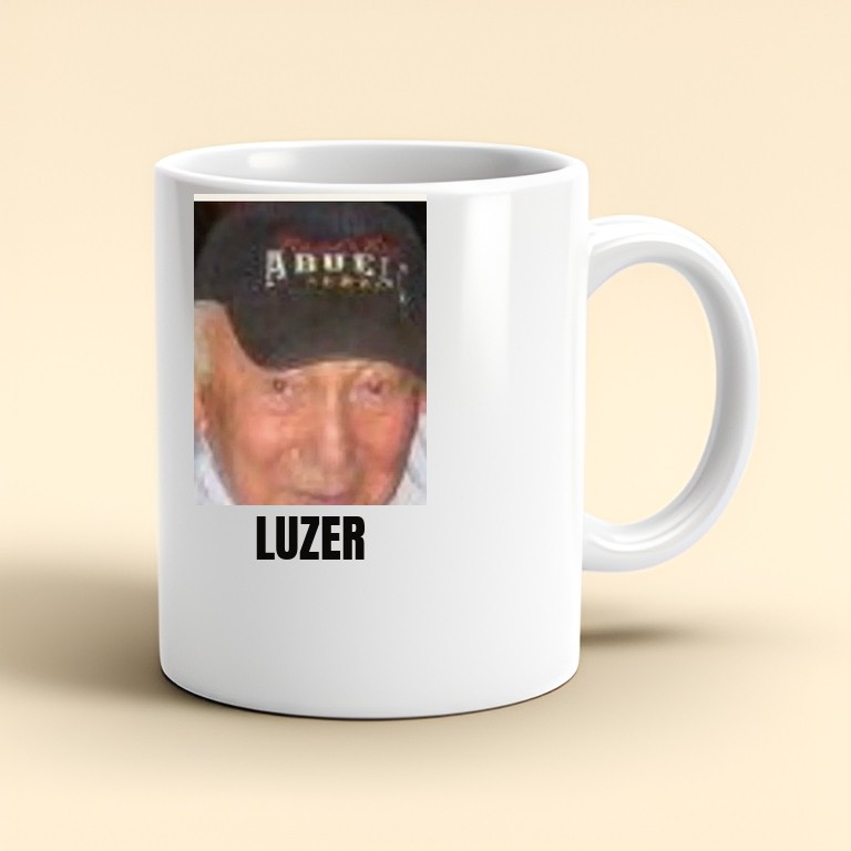 White ceramic mug printed with Luzer's face and the word LUZER